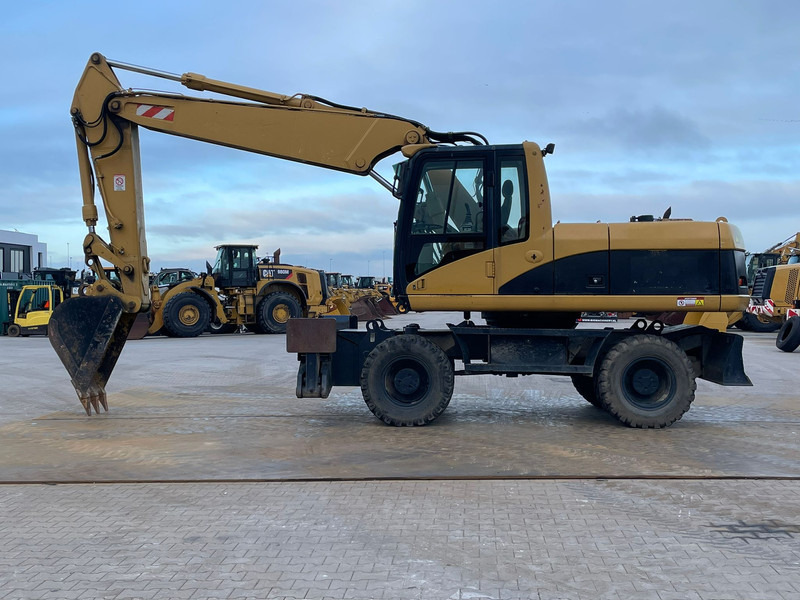 Caterpillar M318C - Gravemaskine: billede 1 Caterpillar M318C - Gravemaskine: billede 1