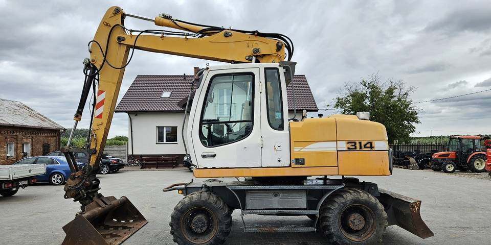 Koparka kołowa Liebherr A314 Litronic 9350 h+ 5 łyżek kołówka - Hjulgravemaskine: billede 1 Koparka kołowa Liebherr A314 Litronic 9350 h+ 5 łyżek kołówka - Hjulgravemaskine: billede 1