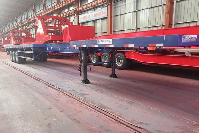 TITAN 3 Axle Extendable Flatbed Trailers for Sale in Angola - Åben sættevogn: billede 1 TITAN 3 Axle Extendable Flatbed Trailers for Sale in Angola - Åben sættevogn: billede 1