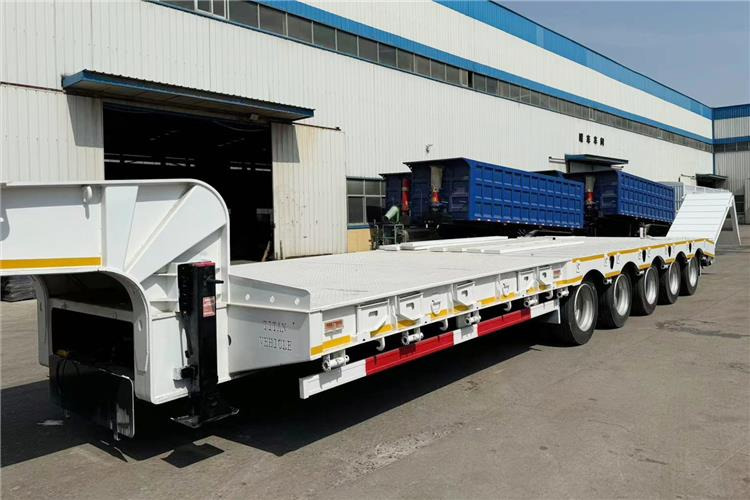 TITAN 5 Axle 100 Ton Low Bed Trailer for Sale In Tanzania - Nedbygget platform sættevogn: billede 4 TITAN 5 Axle 100 Ton Low Bed Trailer for Sale In Tanzania - Nedbygget platform sættevogn: billede 4