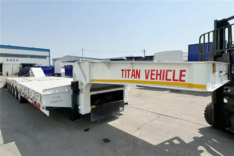 TITAN 5 Axle 100 Ton Low Bed Trailer for Sale In Tanzania - Nedbygget platform sættevogn: billede 5 TITAN 5 Axle 100 Ton Low Bed Trailer for Sale In Tanzania - Nedbygget platform sættevogn: billede 5