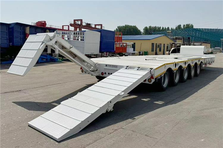 TITAN 5 Axle 100 Ton Low Bed Trailer for Sale In Tanzania - Nedbygget platform sættevogn: billede 2 TITAN 5 Axle 100 Ton Low Bed Trailer for Sale In Tanzania - Nedbygget platform sættevogn: billede 2