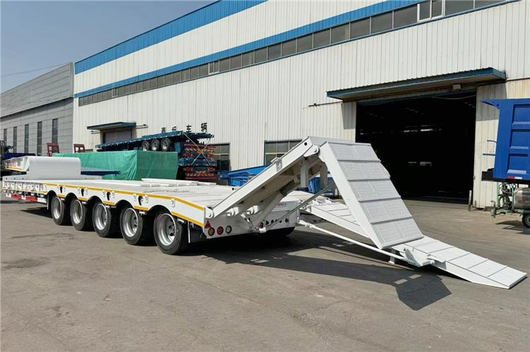 TITAN 5 Axle 100 Ton Low Bed Trailer for Sale In Tanzania - Nedbygget platform sættevogn: billede 1 TITAN 5 Axle 100 Ton Low Bed Trailer for Sale In Tanzania - Nedbygget platform sættevogn: billede 1