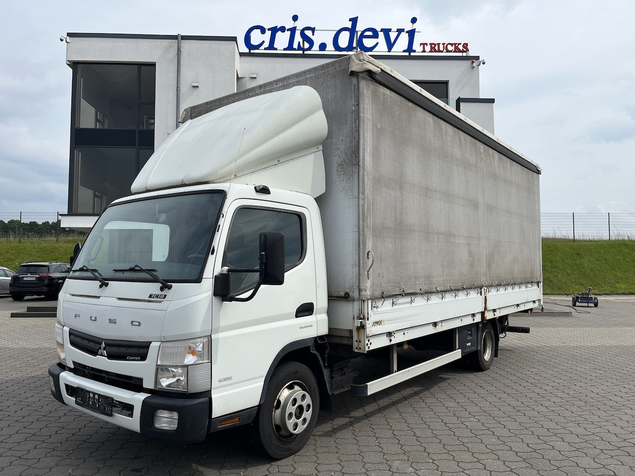 FUSO Canter 7C18 4x2 Ladebordwand Getriebeschaden - Varebil med presenning: billede 1 FUSO Canter 7C18 4x2 Ladebordwand Getriebeschaden - Varebil med presenning: billede 1