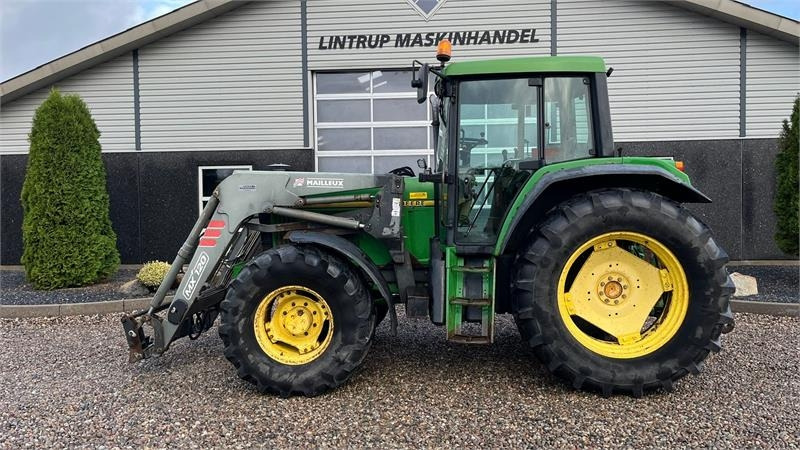 John Deere 6506 Med frontlæsser og vendegear ved rattet - Traktor: billede 1 John Deere 6506 Med frontlæsser og vendegear ved rattet - Traktor: billede 1
